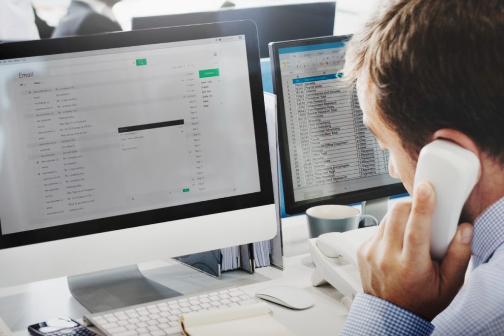 man is writing e-mail